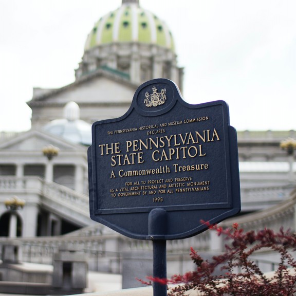 Pennsylvania State Capitol signage with capitol building in background